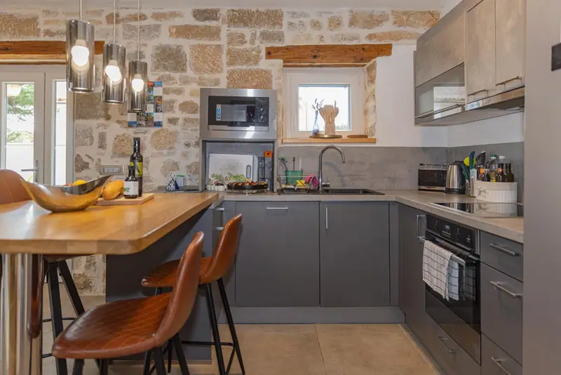 Kitchen with induction hob, oven and microwave