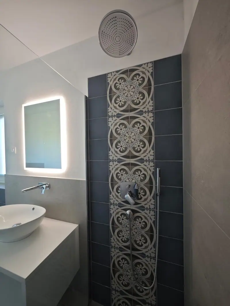 Bathroom with illuminated mirror