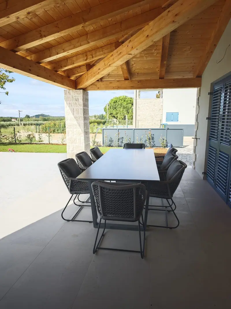 Terrace with dining table and view of the greenery