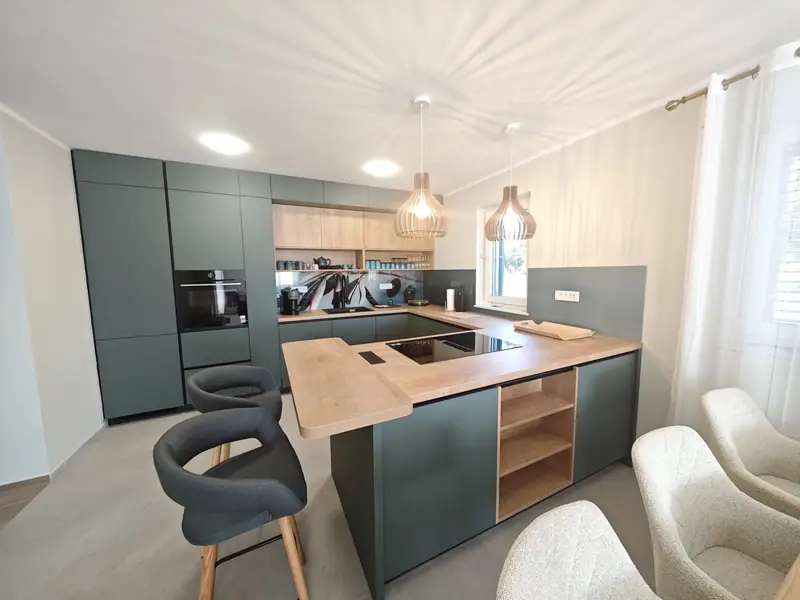 Kitchen with cooking island and bar stools