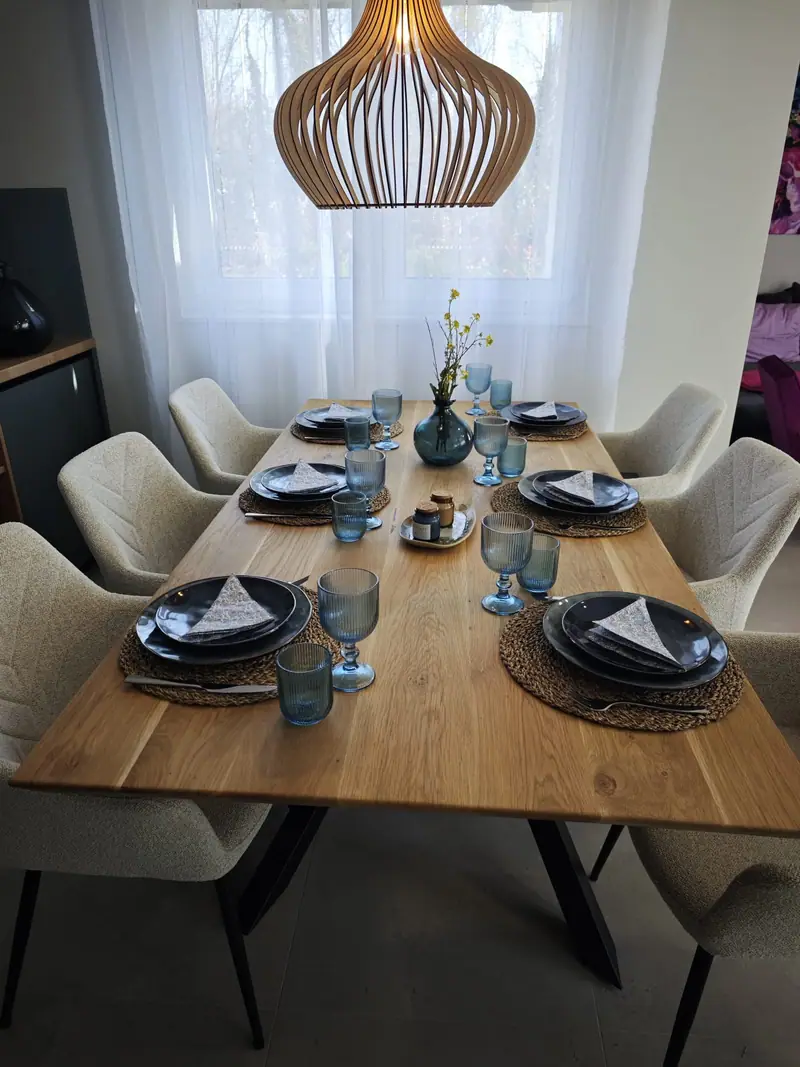 Laid dining table under a pendant lamp